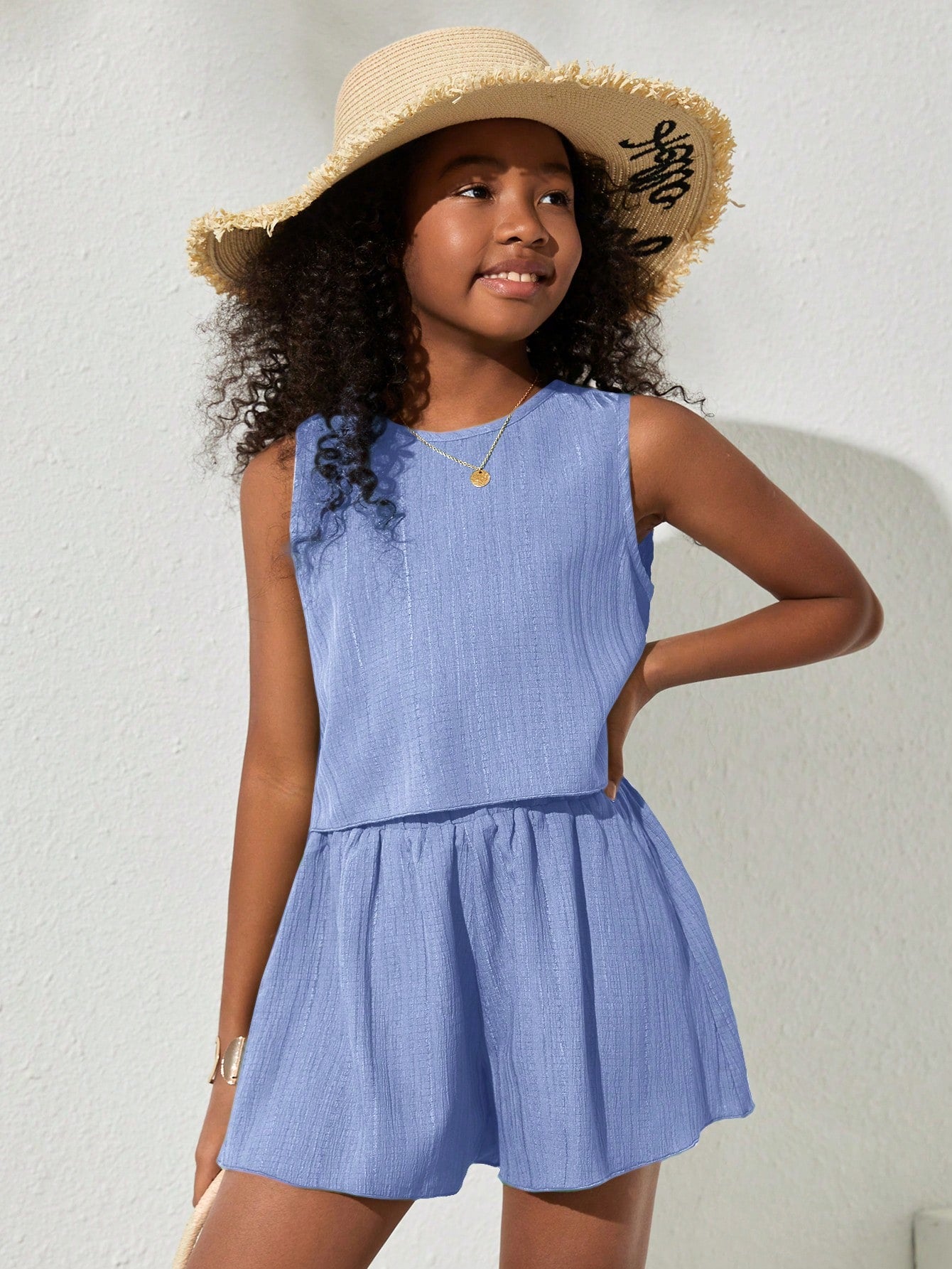Tween girls army green casual outfit featuring a sleeveless round neck top with button details paired with matching woven loose shorts.
