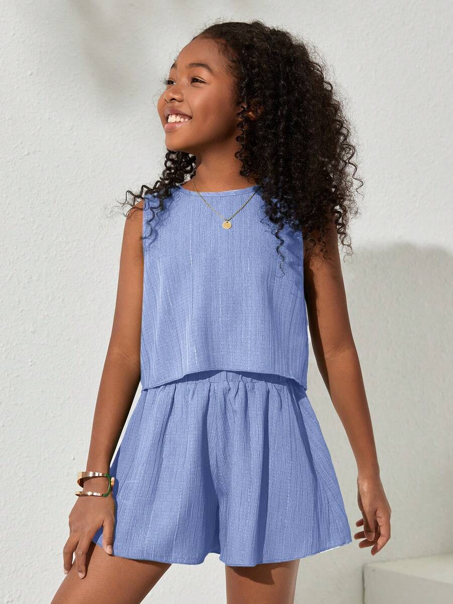 Tween girls army green casual outfit featuring a sleeveless round neck top with button details paired with matching woven loose shorts.