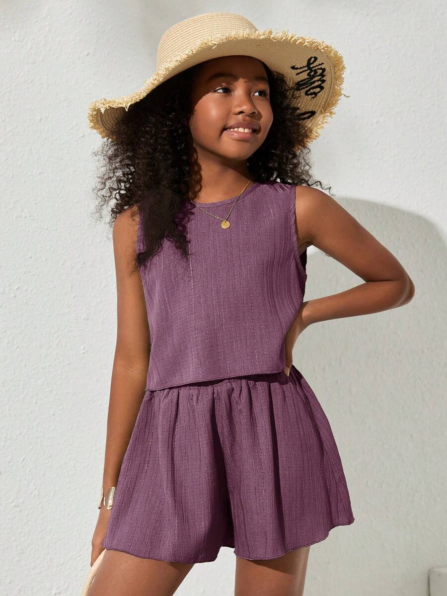 Tween girls army green casual outfit featuring a sleeveless round neck top with button details paired with matching woven loose shorts.