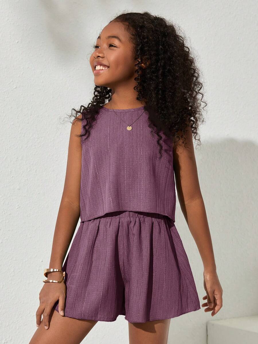Tween girls army green casual outfit featuring a sleeveless round neck top with button details paired with matching woven loose shorts.