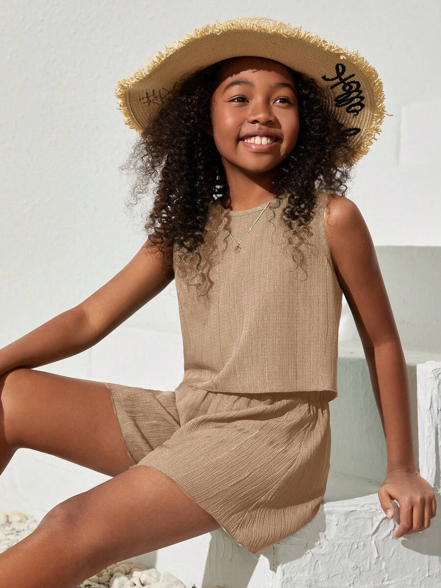 Tween girls army green casual outfit featuring a sleeveless round neck top with button details paired with matching woven loose shorts.