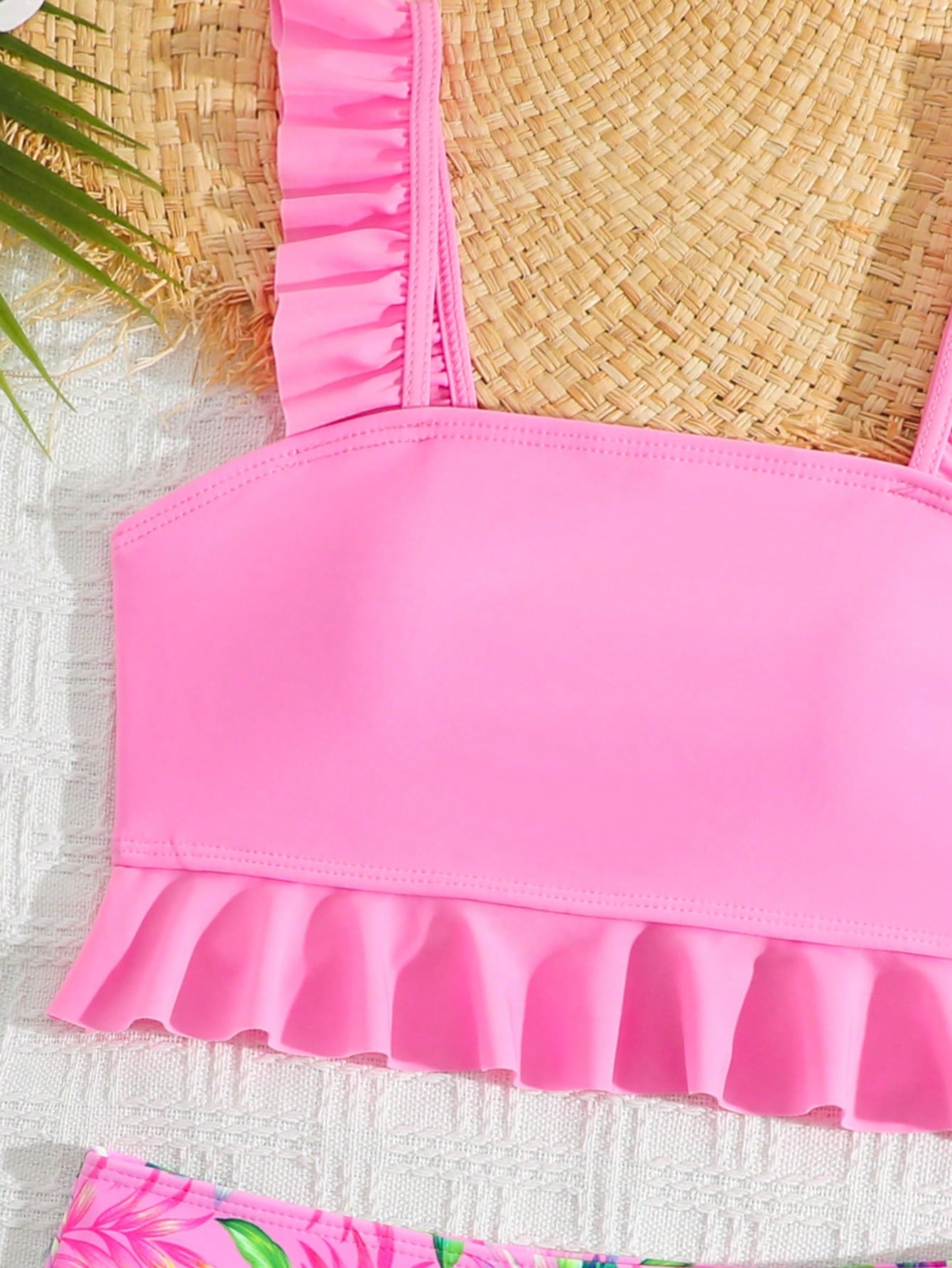 Tween girls solid color 2-piece bikini swimwear set with ruffle detail, strap neckline, wireless bikini top, and triangle mid-waist bikini bottoms; textured pattern with lined bottoms and high-stretch fabric, suitable for summer vacation.