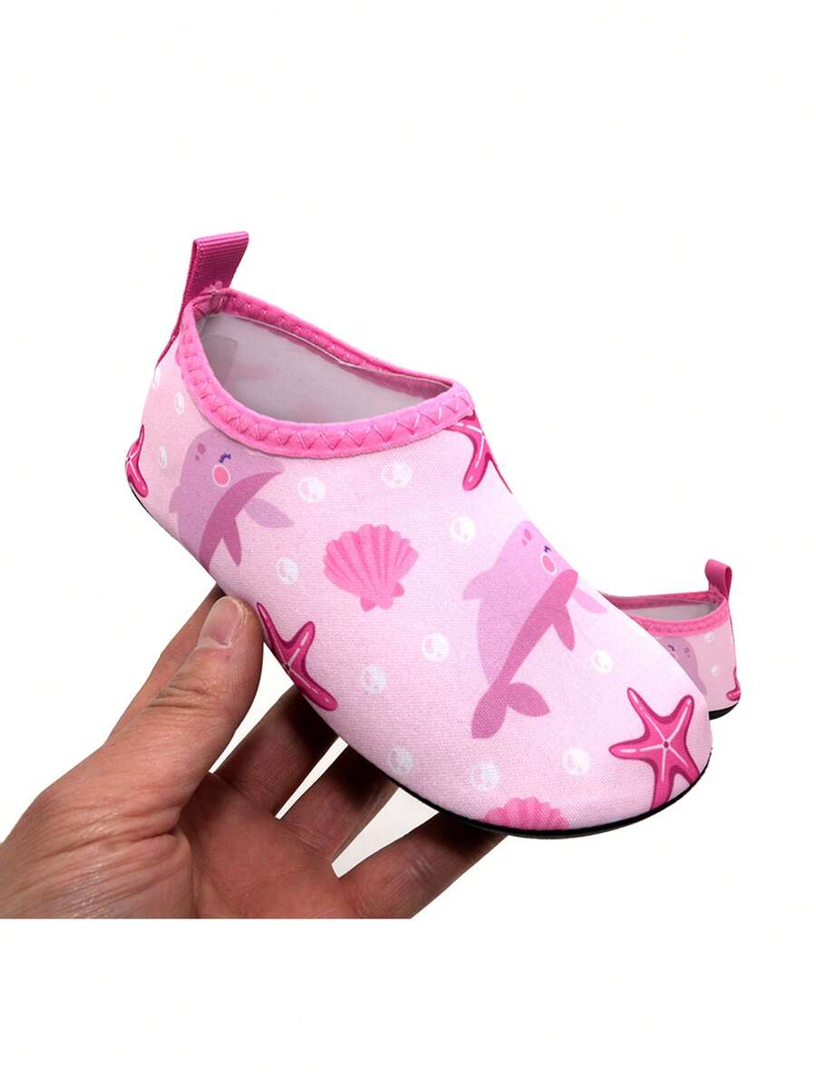 Boys breathable slip-on aqua water shoes featuring contrast binding and non-slip TPR soles for beach and outdoor activities.
