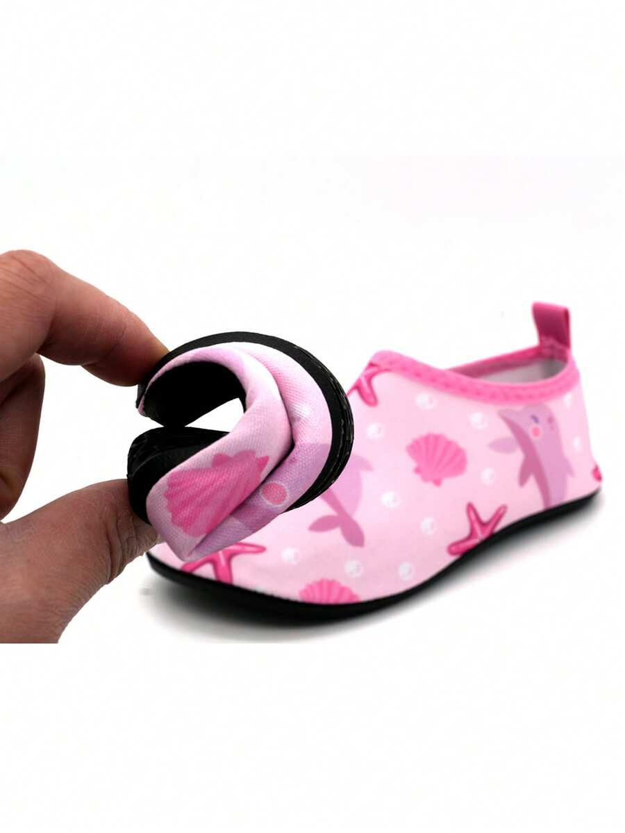 Boys breathable slip-on aqua water shoes featuring contrast binding and non-slip TPR soles for beach and outdoor activities.