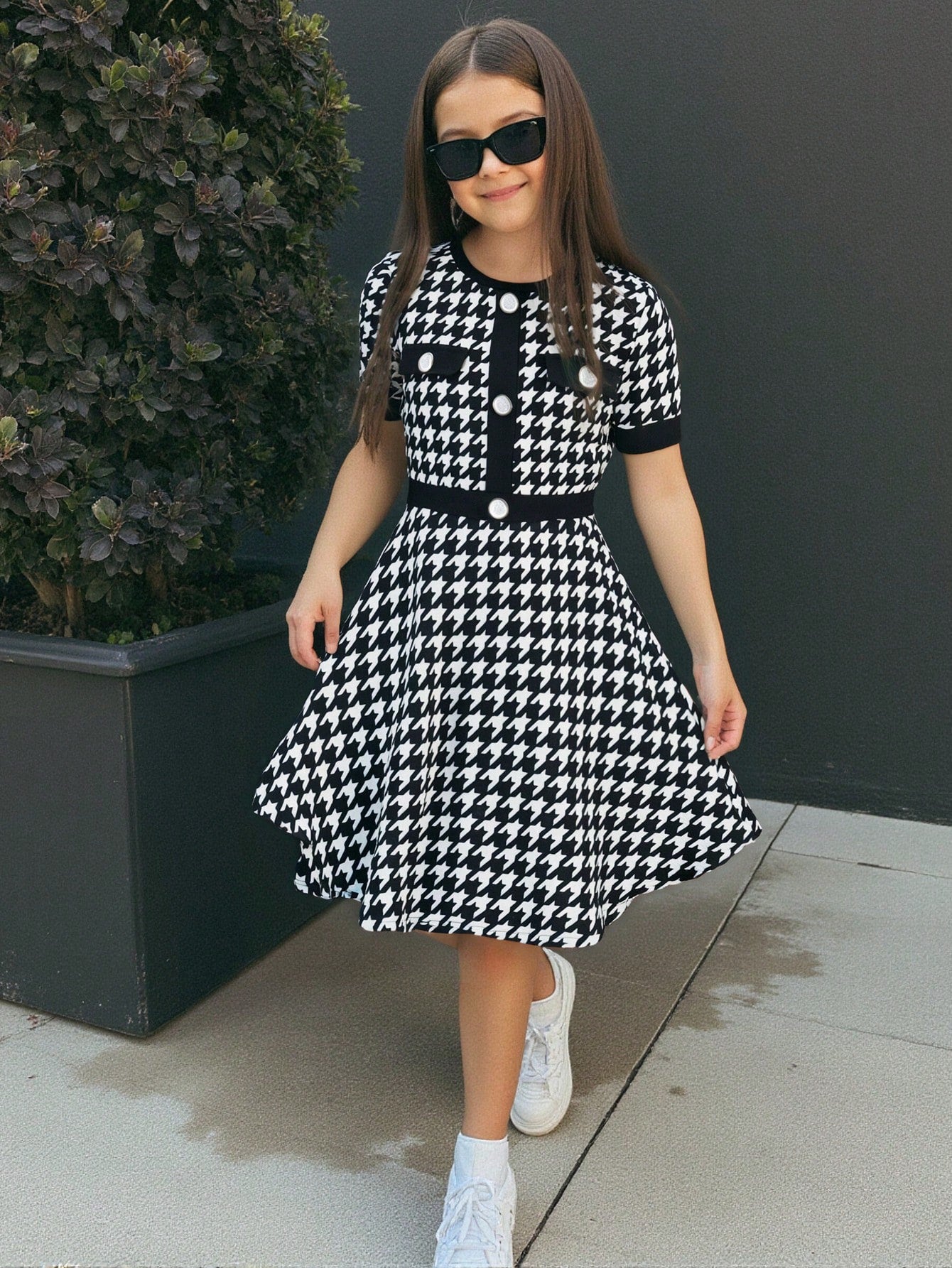Nova Glow tween girls black and white houndstooth print short sleeve A-line dress with decorative buttons and crew neckline.