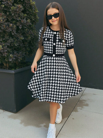 Nova Glow tween girls black and white houndstooth print short sleeve A-line dress with decorative buttons and crew neckline.