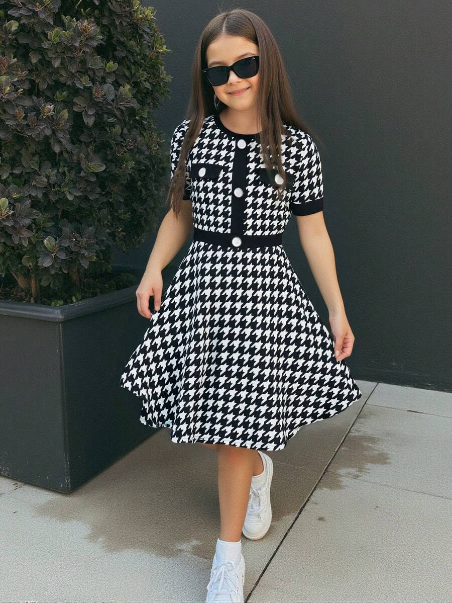 Nova Glow tween girls black and white houndstooth print short sleeve A-line dress with decorative buttons and crew neckline.
