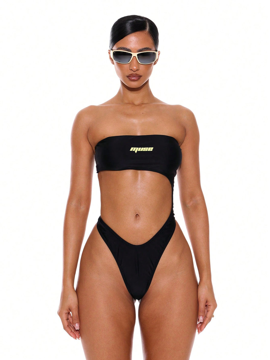 Women's strapless bandeau bikini set featuring stylish cut-out details and high-leg cheeky bottoms.
