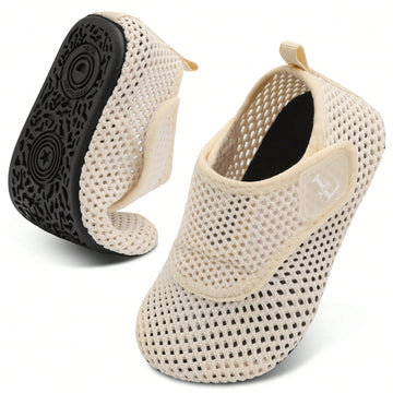 Beige kids aquatic shoes featuring a breathable fabric upper, adjustable hook and loop strap closure, and a flexible non-slip rubber outsole.