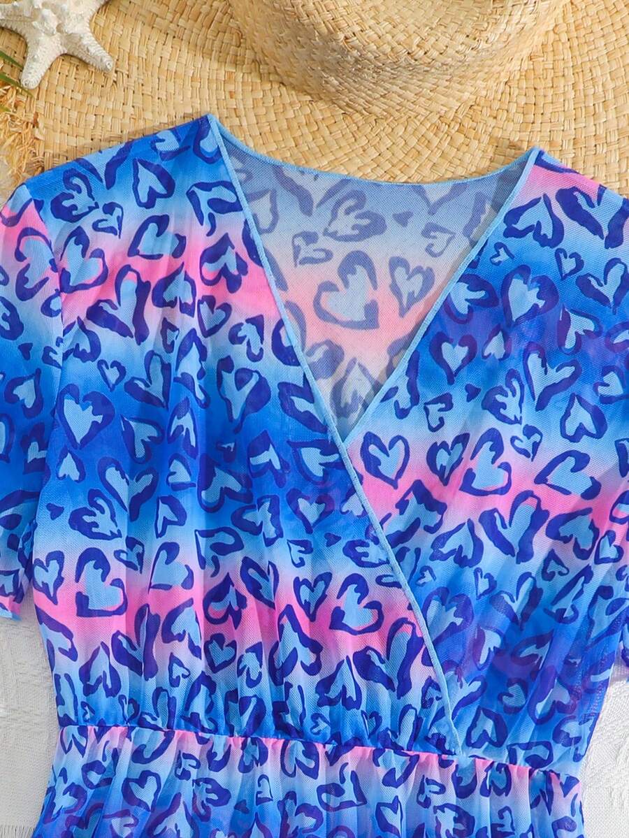 Multicolor heart print long cover up dress for tween girls featuring a V-neck criss-cross wrap front and short sleeves.