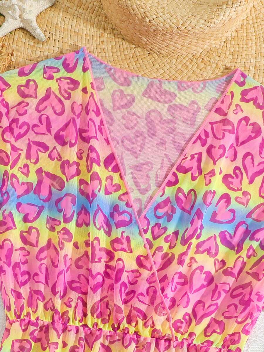 Multicolor heart print long cover up dress for tween girls featuring a V-neck criss-cross wrap front and short sleeves.