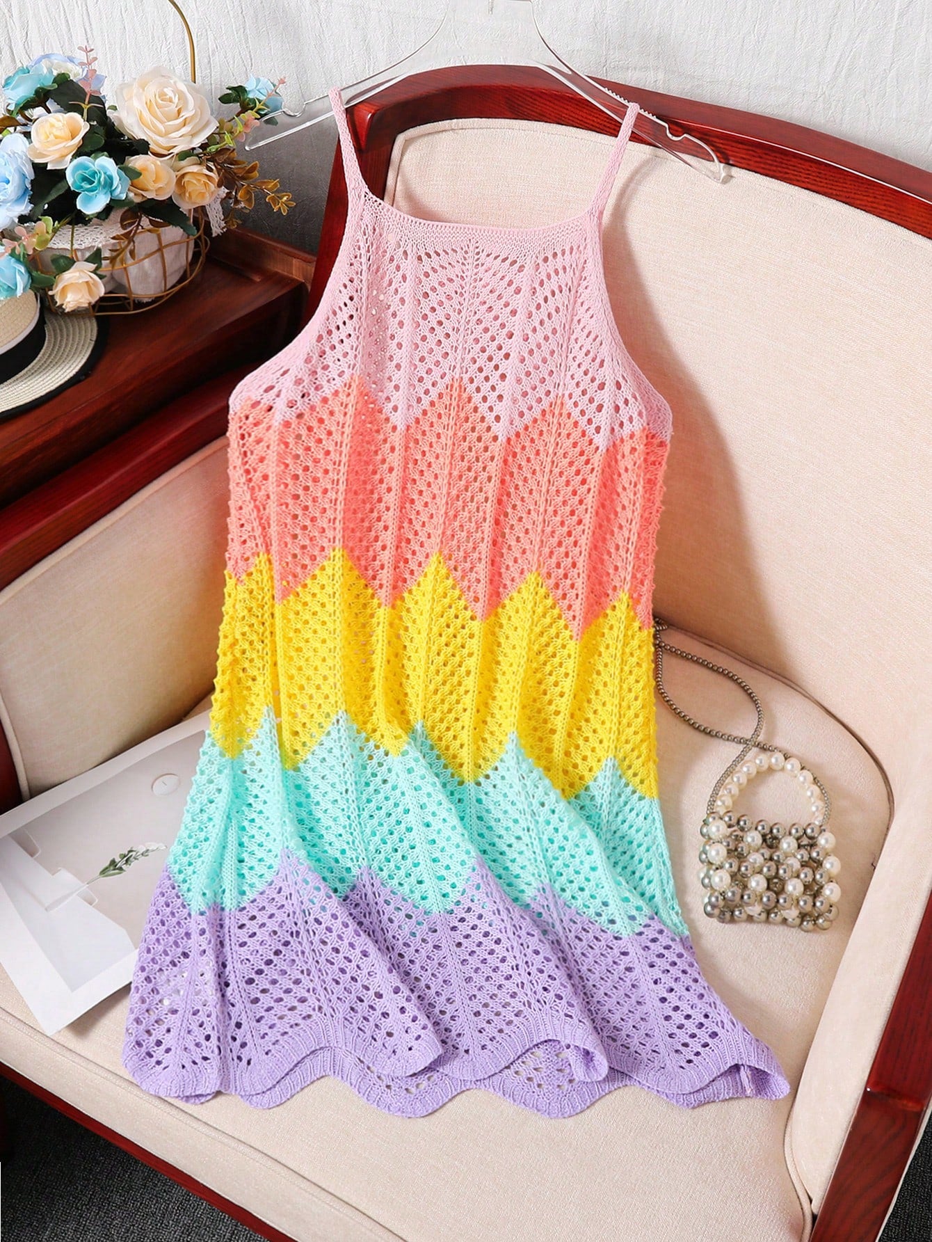 Girls' multicolor rainbow gradient crochet beach cover up with hollow-out knit design, spaghetti straps, sleeveless A-line shape, and semi-sheer finish.