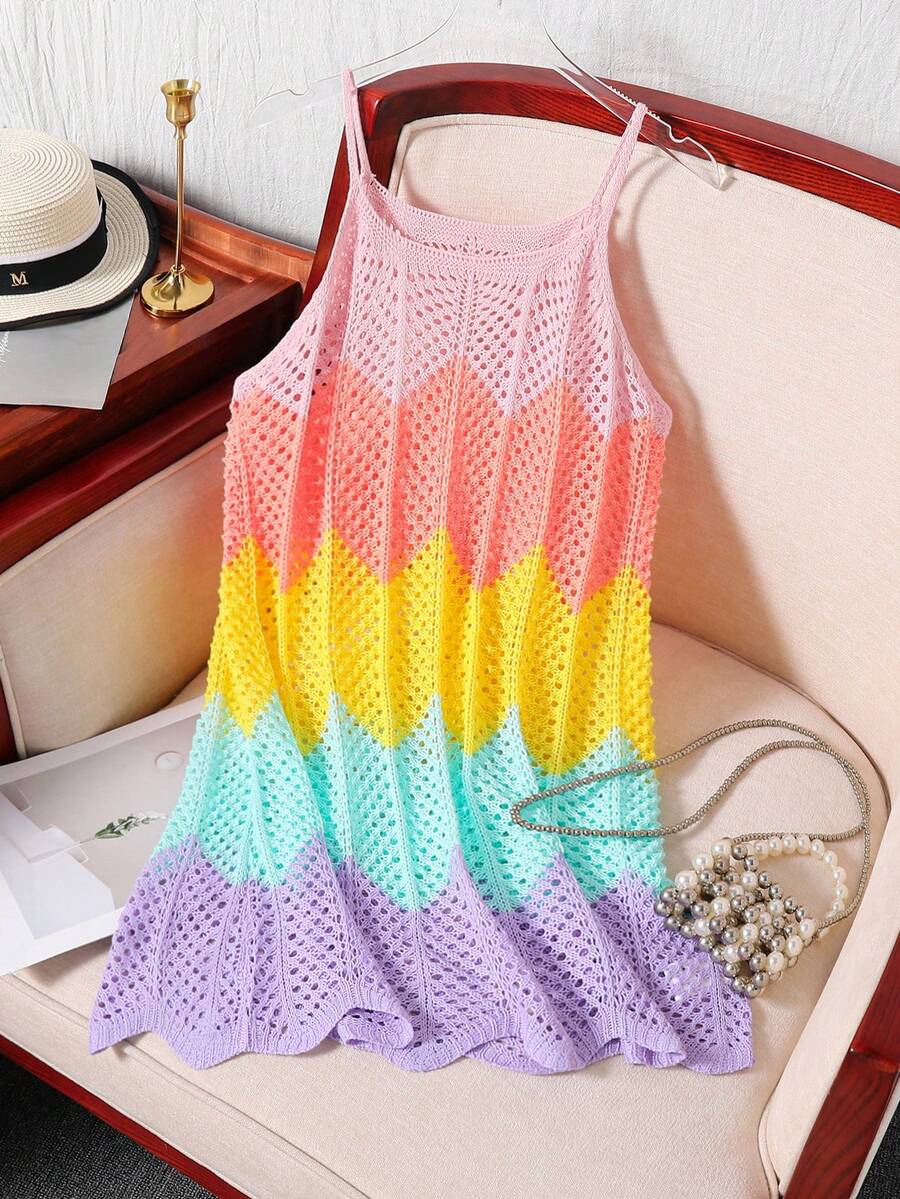 Girls' multicolor rainbow gradient crochet beach cover up with hollow-out knit design, spaghetti straps, sleeveless A-line shape, and semi-sheer finish.