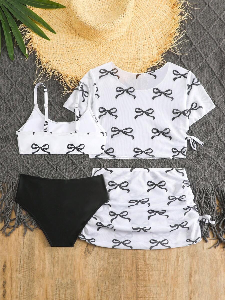 Tween girls 4-piece boho butterfly print bikini set in blue featuring spaghetti strap top, mid waist bottoms, and matching cover-up skirt.