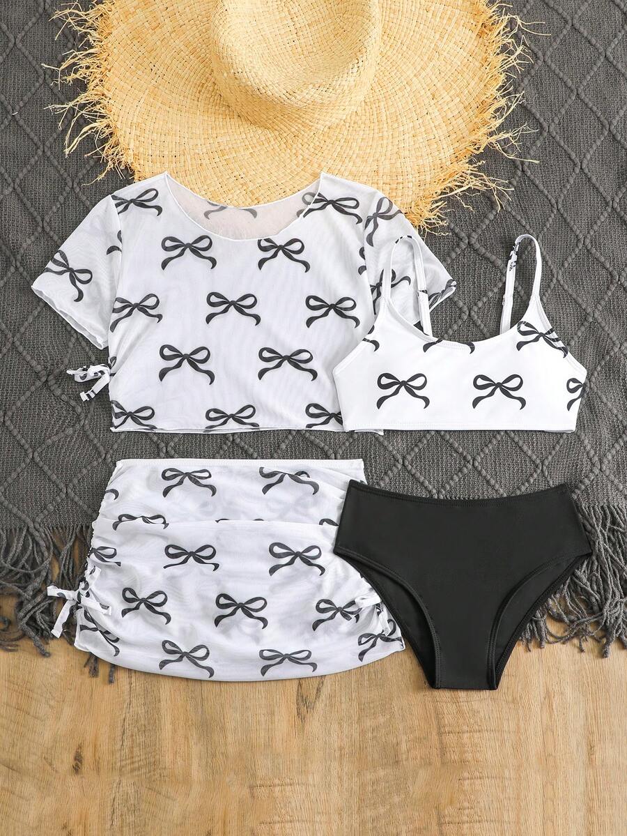 Tween girls 4-piece boho butterfly print bikini set in blue featuring spaghetti strap top, mid waist bottoms, and matching cover-up skirt.