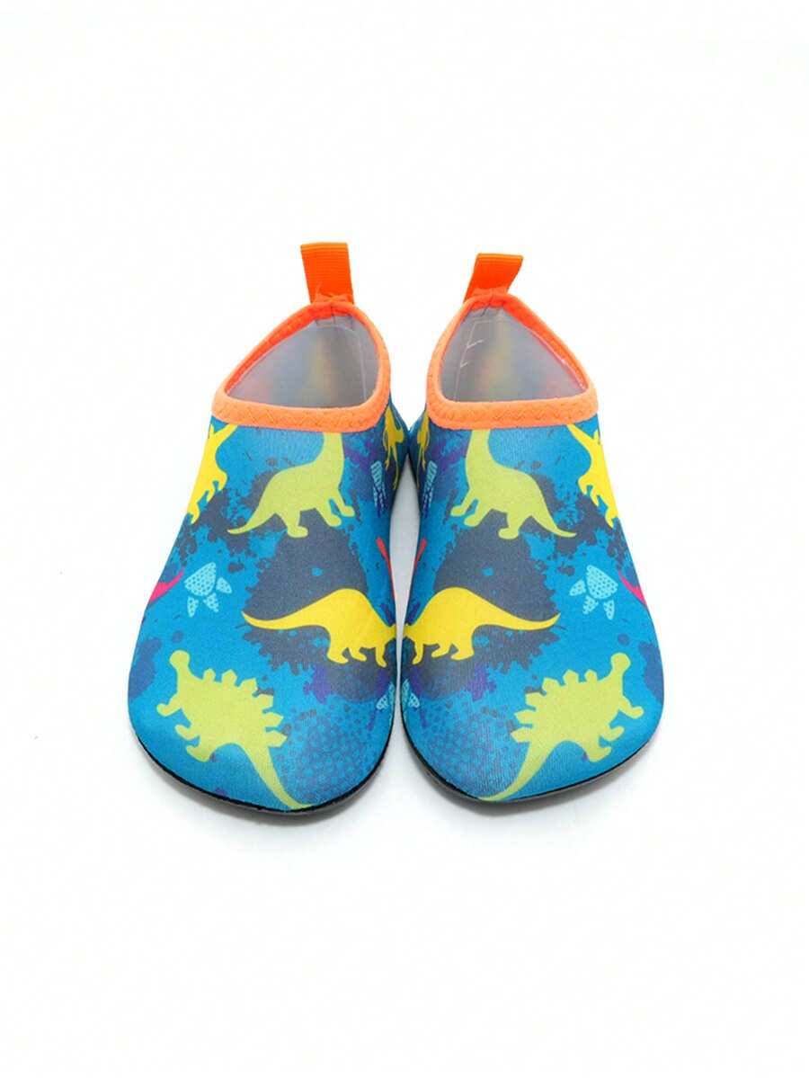 Multicolor cartoon dinosaur kids water shoes with breathable slip-on design and non-slip rubber outsole for boys.