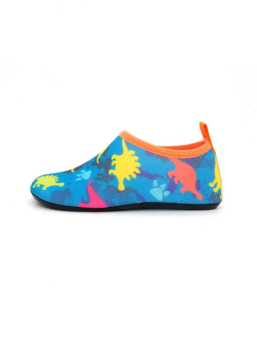 Multicolor cartoon dinosaur kids water shoes with breathable slip-on design and non-slip rubber outsole for boys.