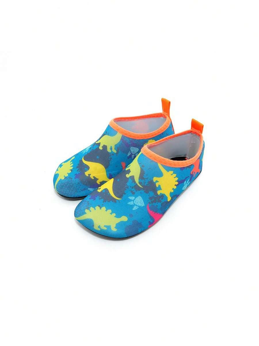 Multicolor cartoon dinosaur kids water shoes with breathable slip-on design and non-slip rubber outsole for boys.