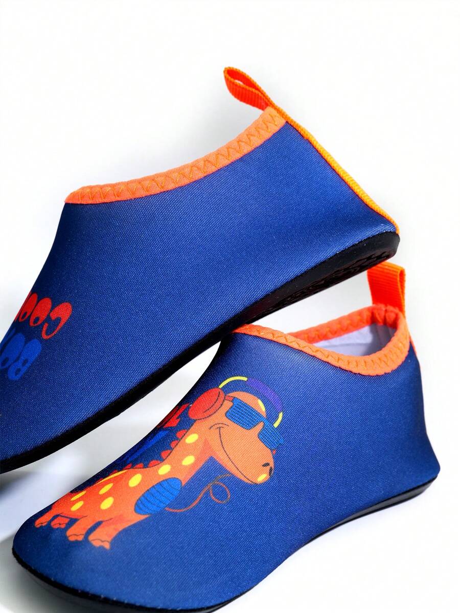 Multicolor cartoon dinosaur kids water shoes with breathable slip-on design and non-slip rubber outsole for boys.