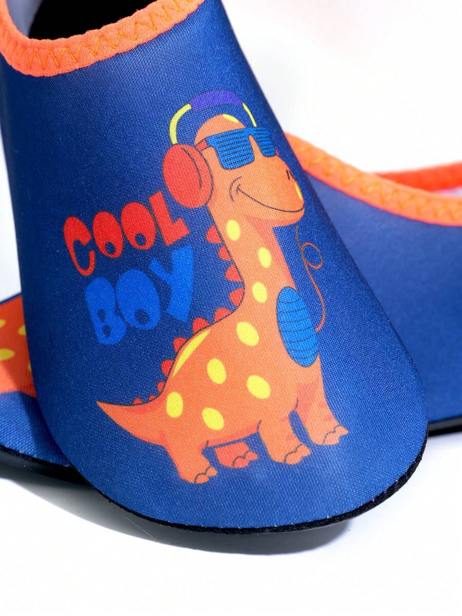 Multicolor cartoon dinosaur kids water shoes with breathable slip-on design and non-slip rubber outsole for boys.