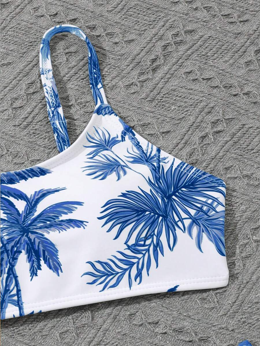 Tween girls 4-piece boho butterfly print bikini set in blue featuring spaghetti strap top, mid waist bottoms, and matching cover-up skirt.