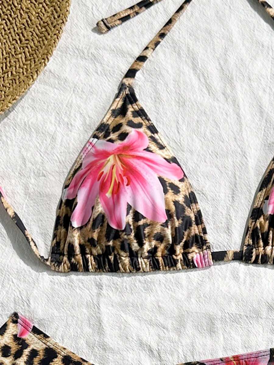 Women's black 3-piece bikini set featuring a halter triangle top with removable padding, high-waisted bottoms, and a knee-length mesh skirt with tie details.