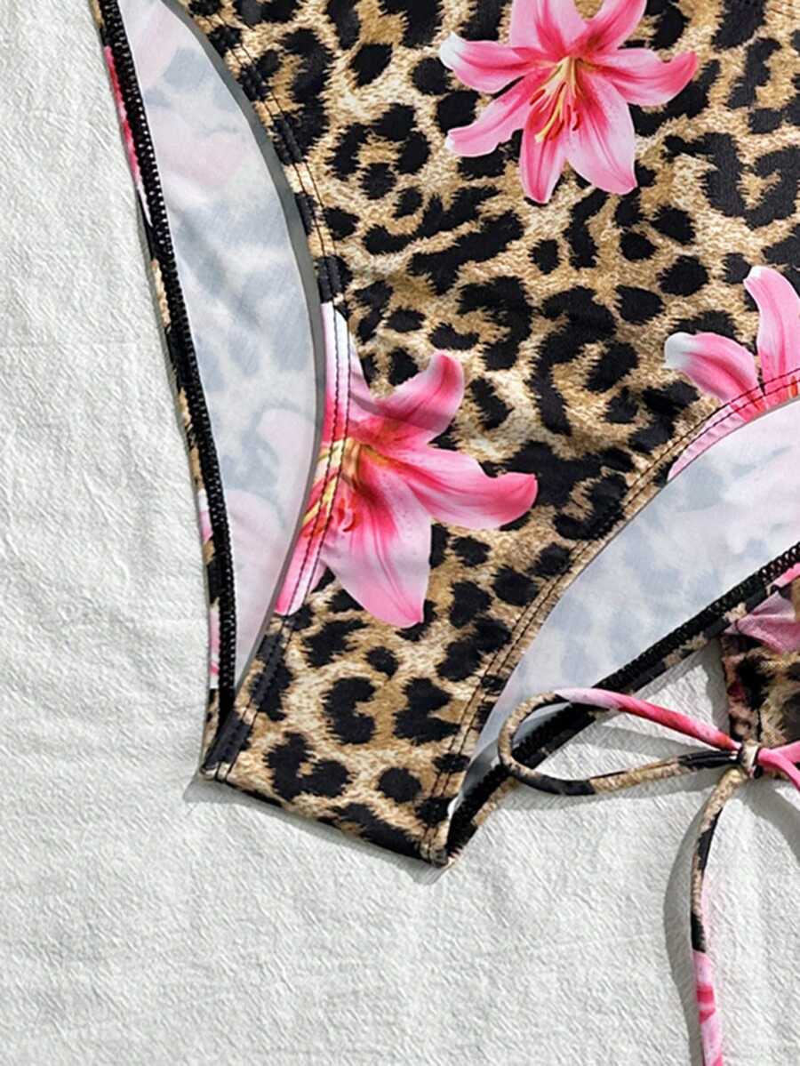 Women's black 3-piece bikini set featuring a halter triangle top with removable padding, high-waisted bottoms, and a knee-length mesh skirt with tie details.