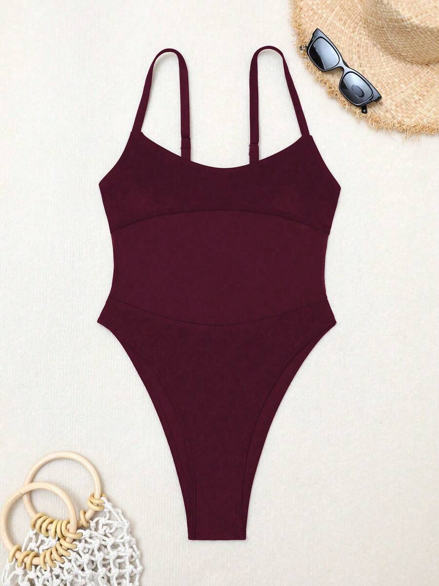 Black floral print mesh patchwork one-piece swimsuit for women featuring spaghetti straps, V-wired triangle cups, and a high waist silhouette.