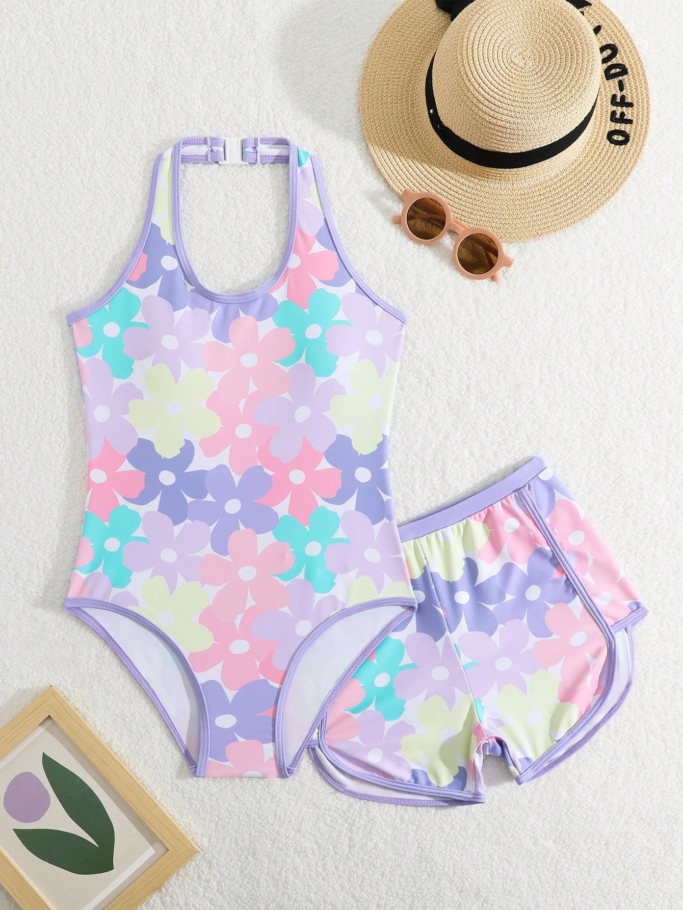 Girls 2-piece swimwear set featuring a butterfly print halter swimsuit top with contrast piping and separate mid-waist shorts; sleeveless, high-stretch, wireless design for beach and vacation wear.