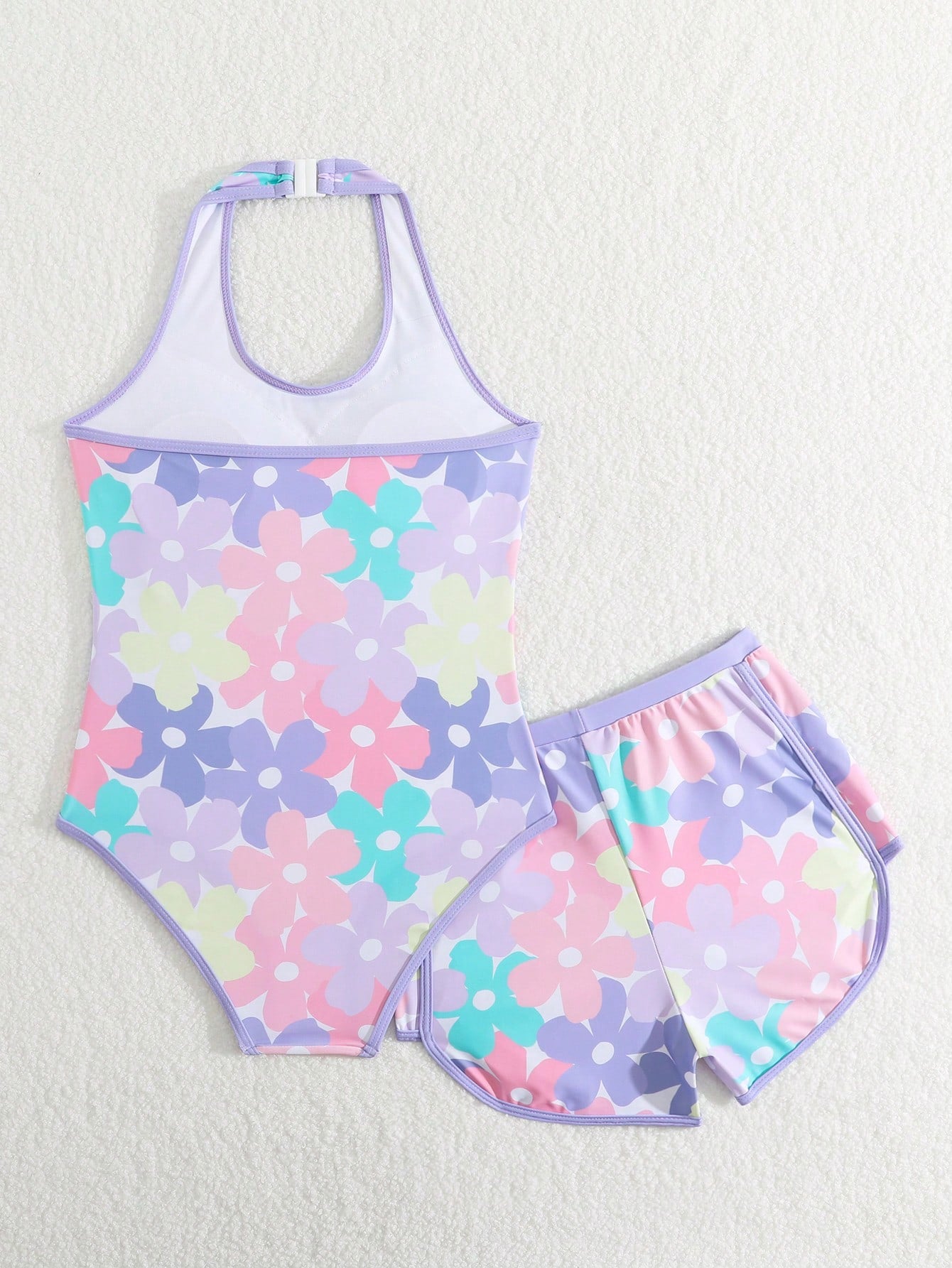 Girls 2-piece swimwear set featuring a butterfly print halter swimsuit top with contrast piping and separate mid-waist shorts; sleeveless, high-stretch, wireless design for beach and vacation wear.