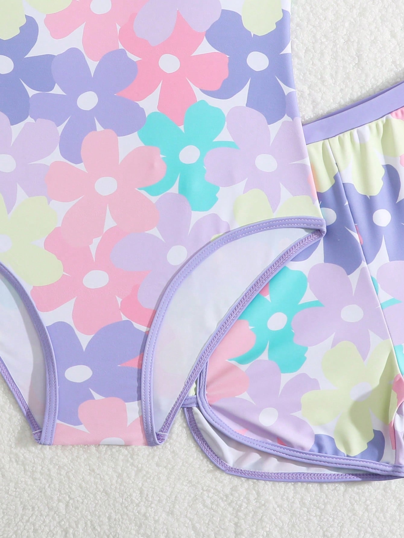 Girls 2-piece swimwear set featuring a butterfly print halter swimsuit top with contrast piping and separate mid-waist shorts; sleeveless, high-stretch, wireless design for beach and vacation wear.