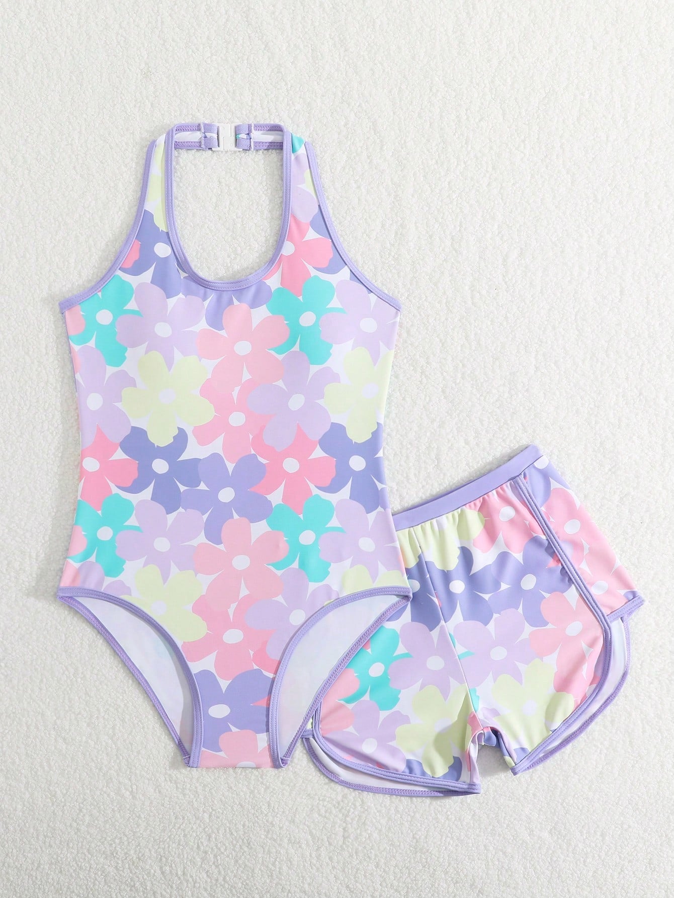 Girls 2-piece swimwear set featuring a butterfly print halter swimsuit top with contrast piping and separate mid-waist shorts; sleeveless, high-stretch, wireless design for beach and vacation wear.