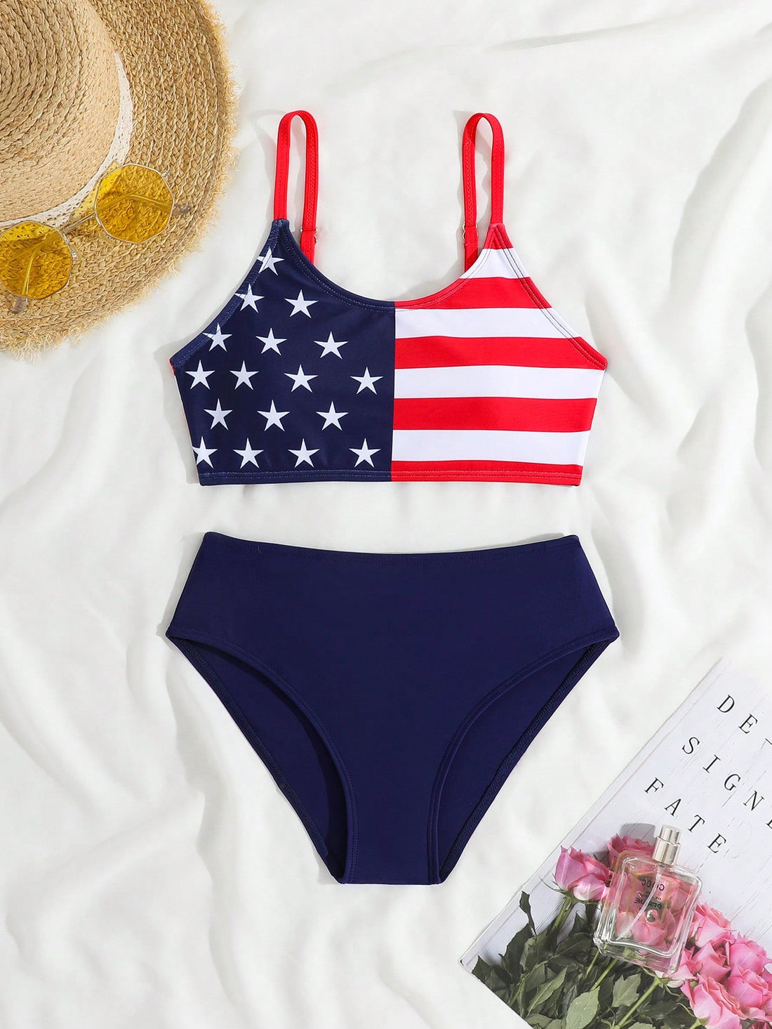Blue tween girls bikini set with American flag and geometric print, featuring a sleeveless spaghetti strap wireless bikini top and high-waist bikini bottoms, suitable for summer beach vacation.