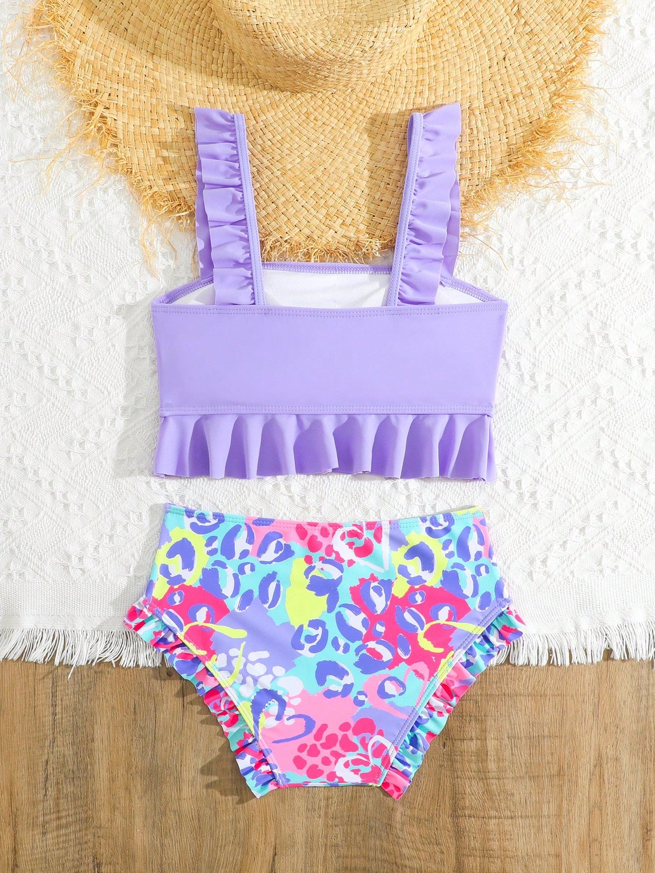 Tween girls solid color 2-piece bikini swimwear set with ruffle detail, strap neckline, wireless bikini top, and triangle mid-waist bikini bottoms; textured pattern with lined bottoms and high-stretch fabric, suitable for summer vacation.