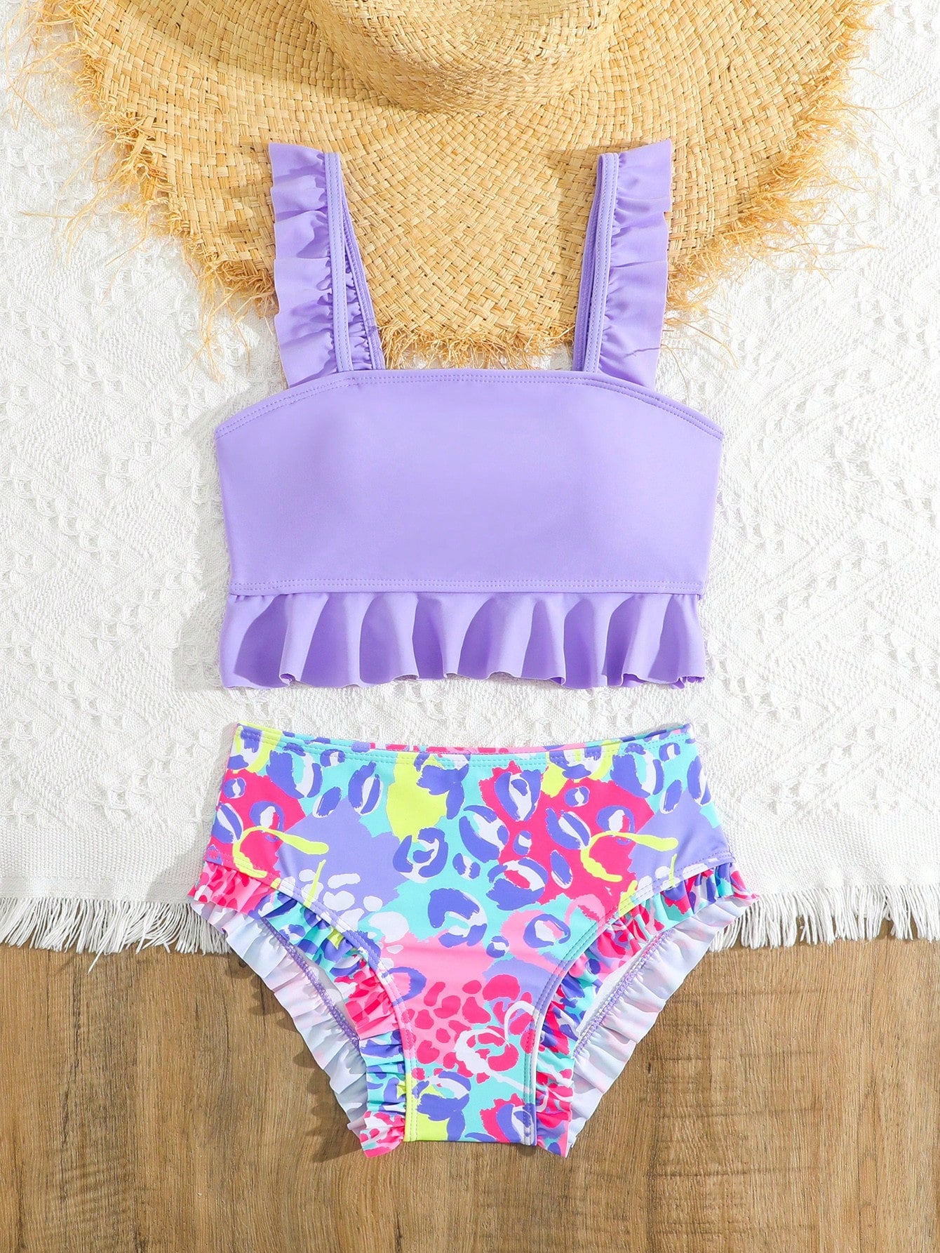 Tween girls solid color 2-piece bikini swimwear set with ruffle detail, strap neckline, wireless bikini top, and triangle mid-waist bikini bottoms; textured pattern with lined bottoms and high-stretch fabric, suitable for summer vacation.