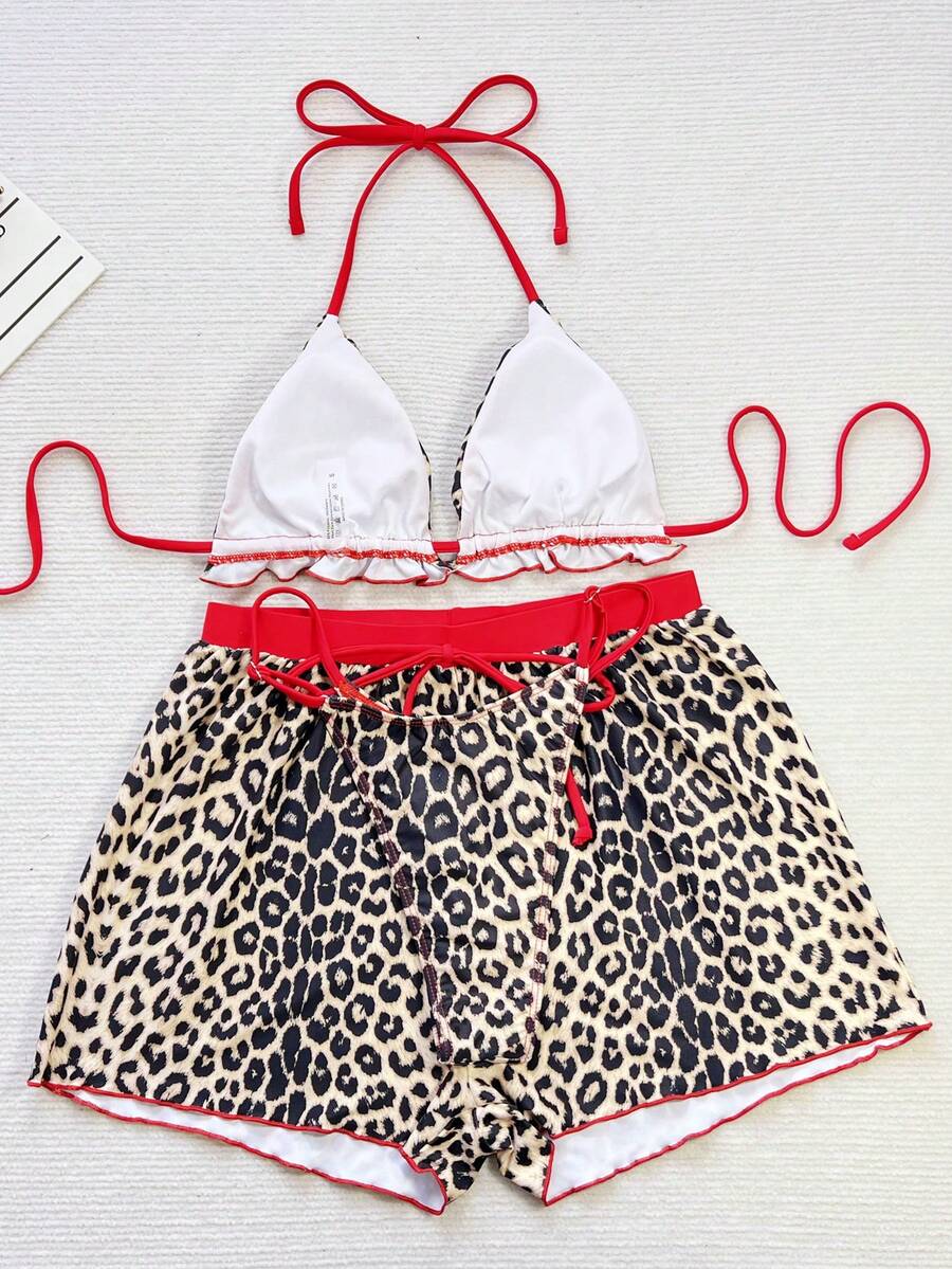 Women's 3-piece frill trim bikini set with halter tie-back top and high waist bottoms.