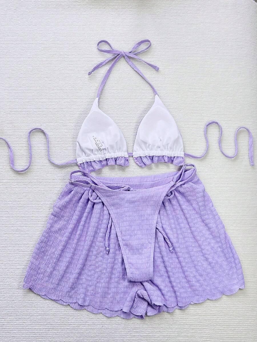Women's 3-piece frill trim bikini set with halter tie-back top and high waist bottoms.