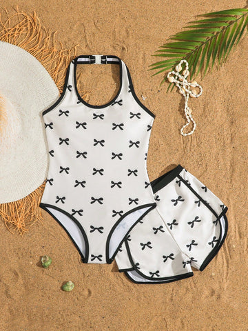 Girls 2-piece swimwear set featuring a butterfly print halter swimsuit top with contrast piping and separate mid-waist shorts; sleeveless, high-stretch, wireless design for beach and vacation wear.