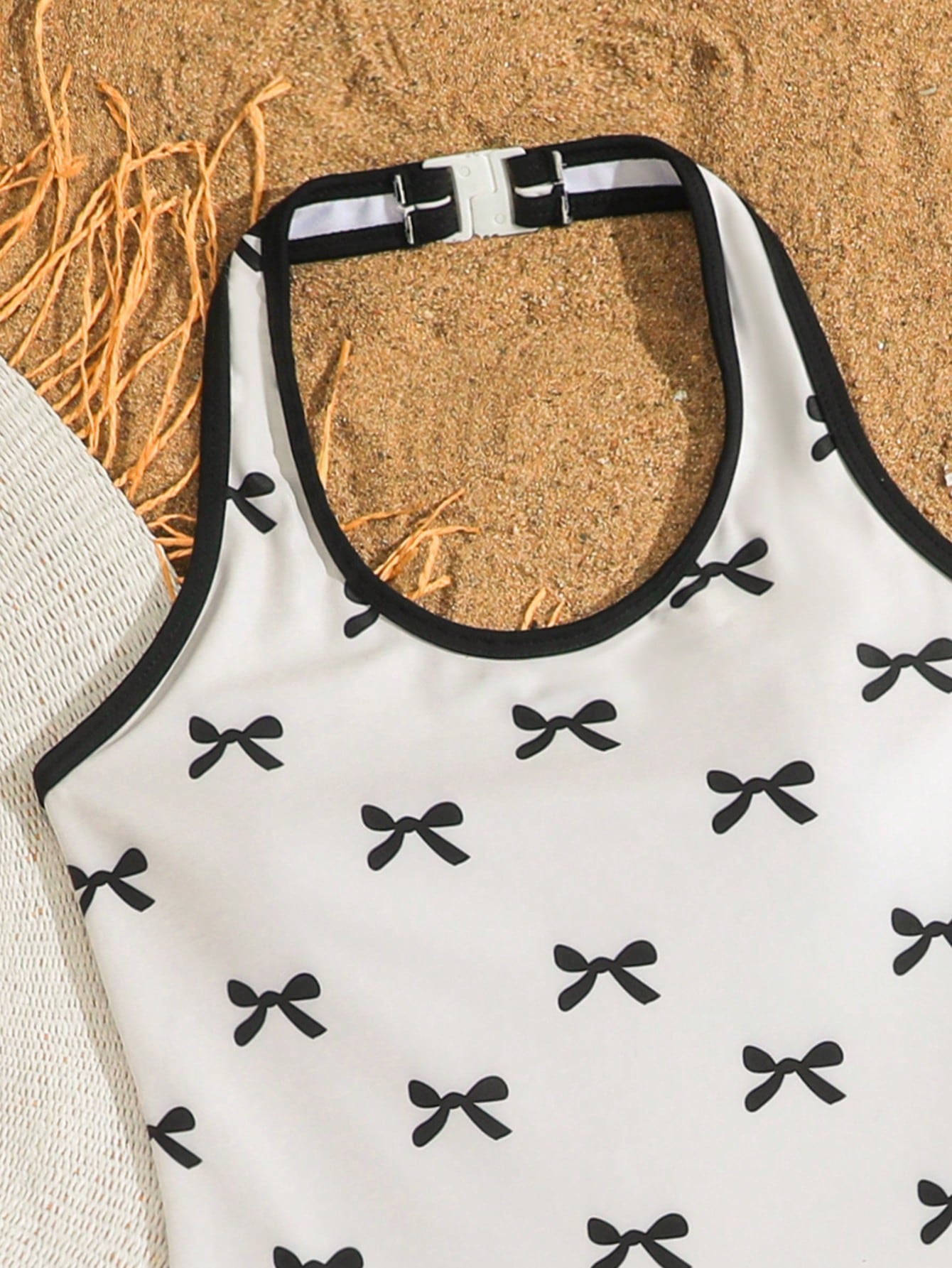 Girls 2-piece swimwear set featuring a butterfly print halter swimsuit top with contrast piping and separate mid-waist shorts; sleeveless, high-stretch, wireless design for beach and vacation wear.