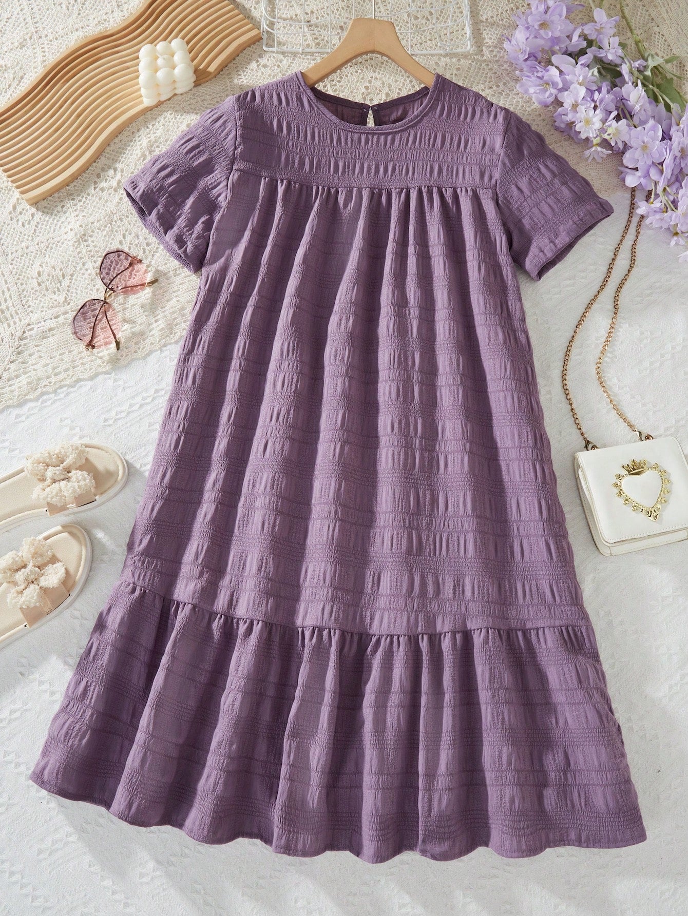 Tween girl wearing an Army Green textured short sleeve smock midi dress with round neck and ruffle flounce hem.