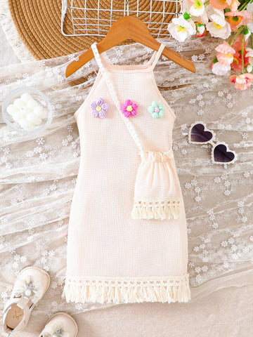 Girls' sleeveless summer midi dress with halter neckline, geometric pattern, applique and fringe details, shown with crossbody bag accessory with tassel decor