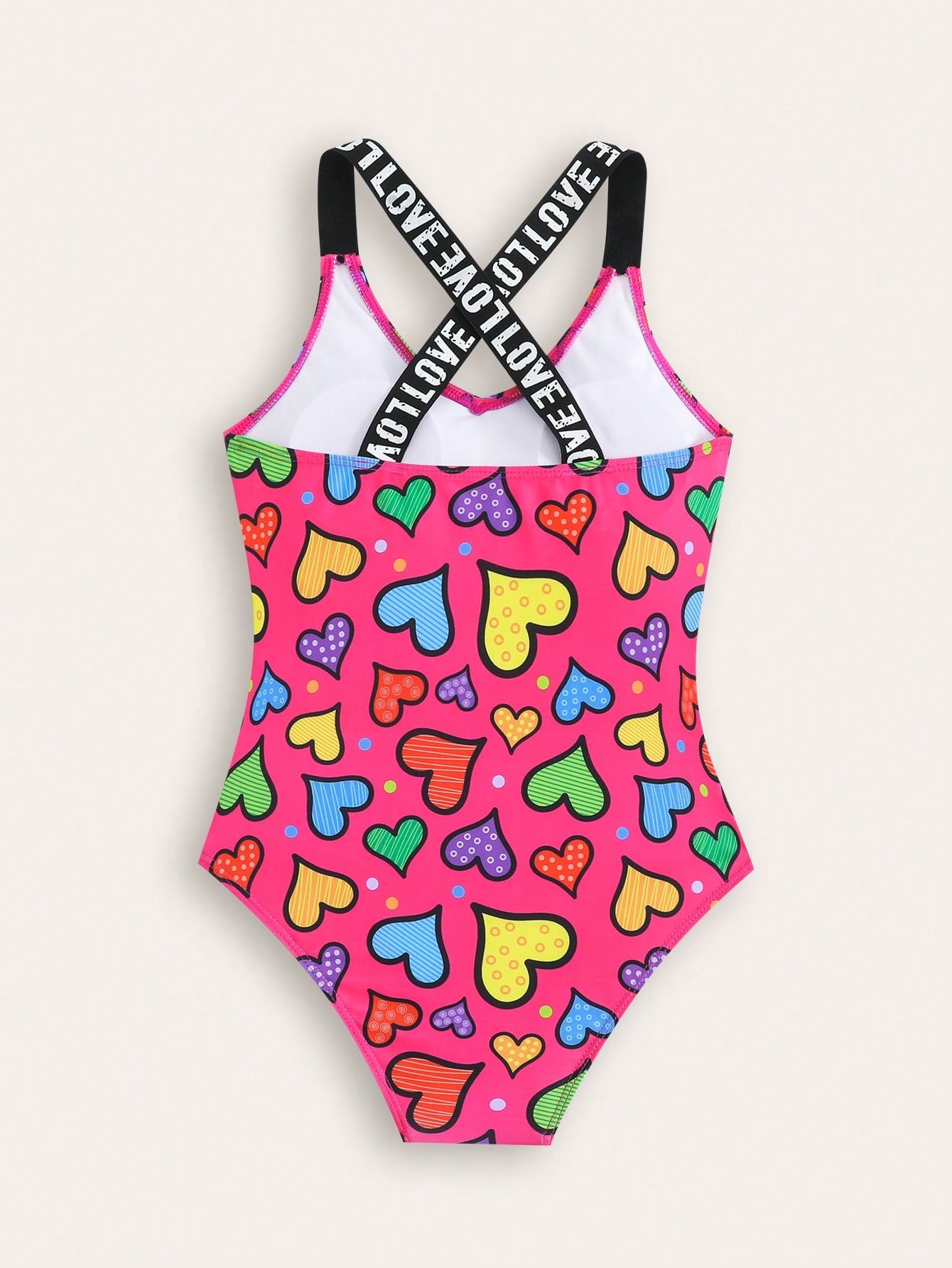 Baby pink girls one-piece swimsuit with ruffle detail, scoop neck, all-over print, and medium-stretch fabric for kids' beach and pool wear.