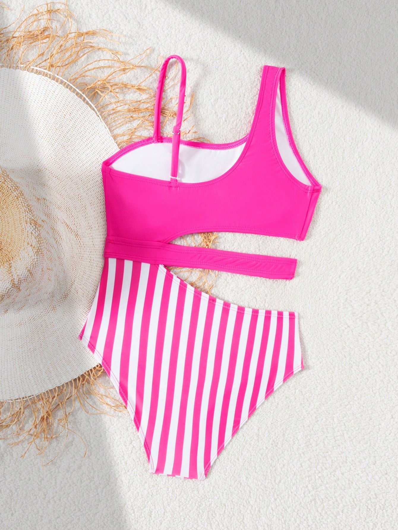 Purple tween girls one-piece swimsuit with asymmetrical neckline, cut-out waist, striped pattern, fitted silhouette, and lined body.