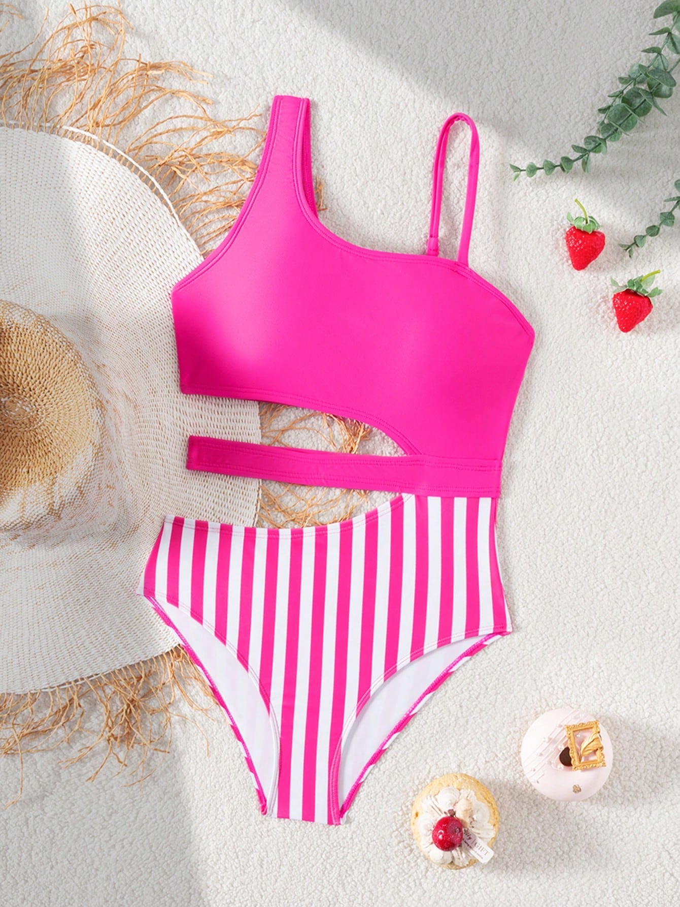 Purple tween girls one-piece swimsuit with asymmetrical neckline, cut-out waist, striped pattern, fitted silhouette, and lined body.