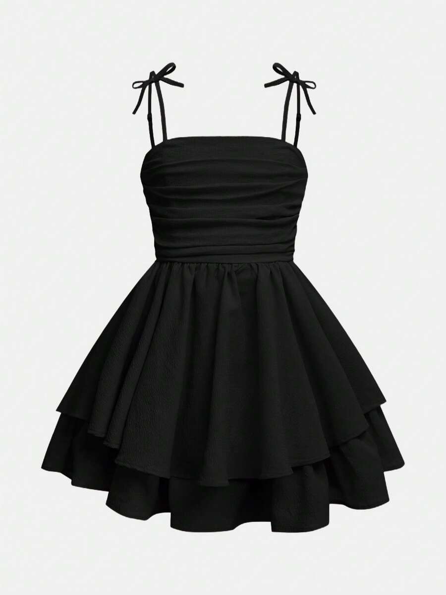 Tween girls apricot tiered cami dress with spaghetti straps, high waist, and slim fit layered hem.