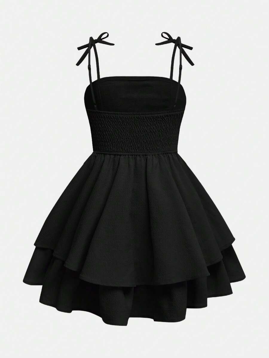 Tween girls apricot tiered cami dress with spaghetti straps, high waist, and slim fit layered hem.