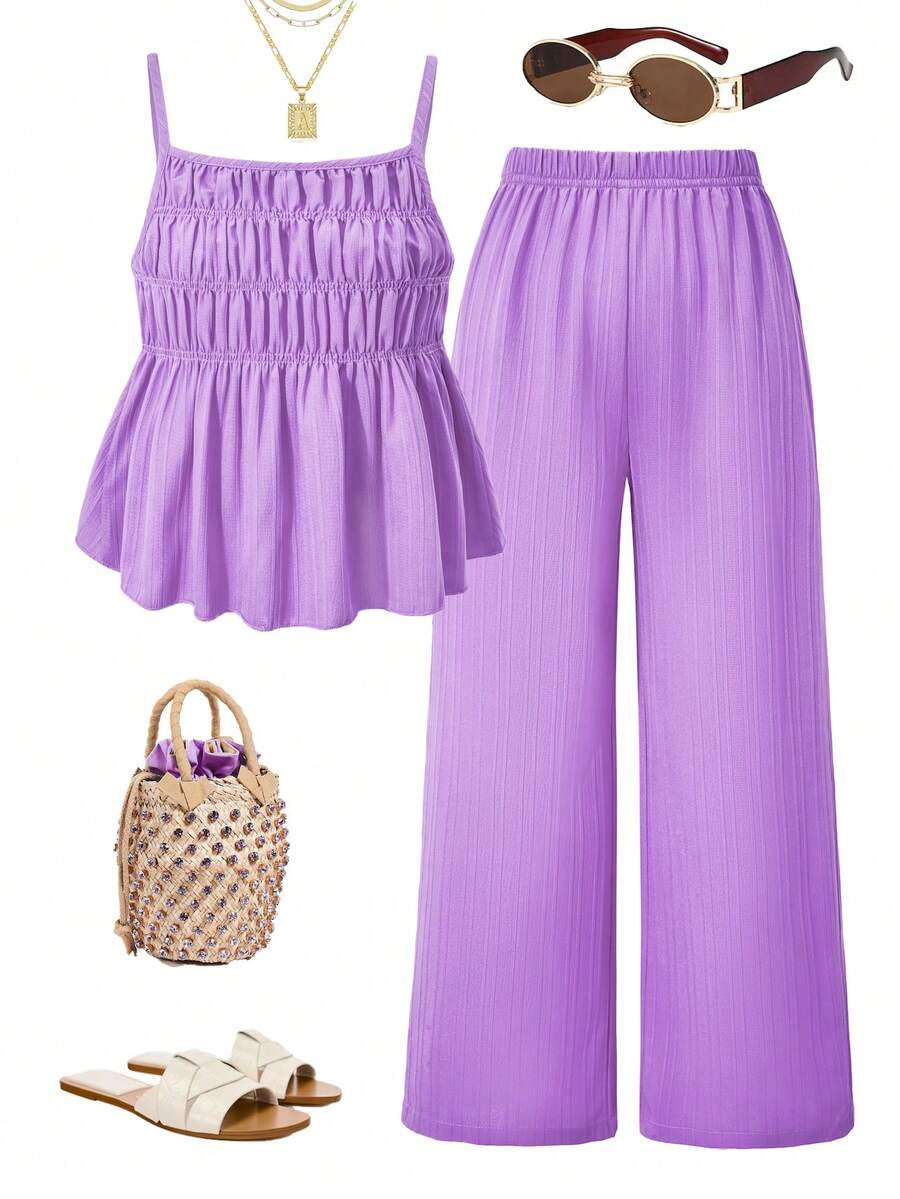 Tween girl wearing an apricot 2-piece outfit set featuring a shirred spaghetti strap short cami top and matching wide-leg long pants.