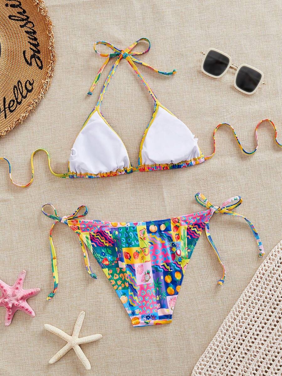 Women's black and white zebra print two-piece bikini set featuring a high waist tie-side bottom and a backless halter top with removable padding.
