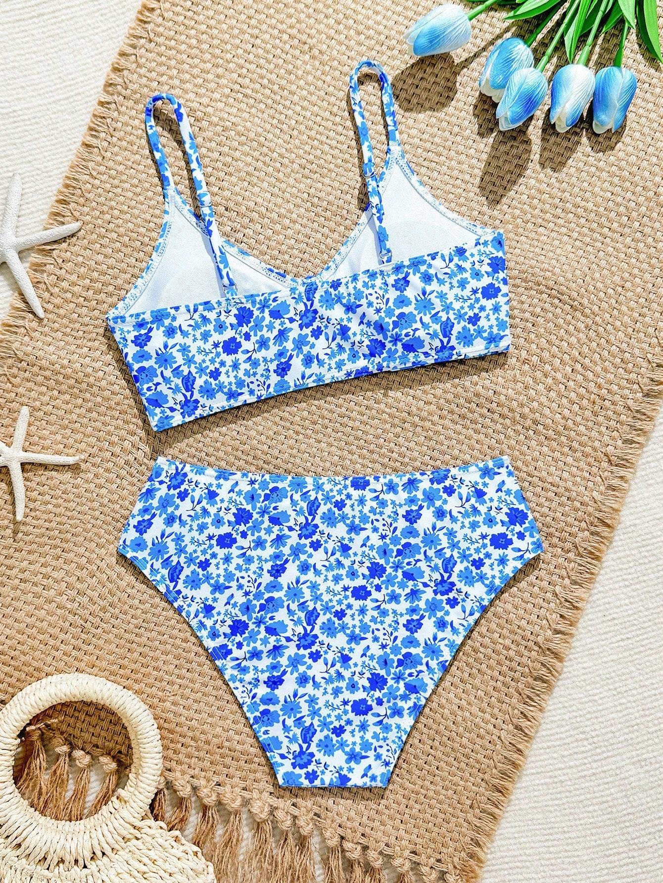 Tween girls 2-piece ditsy floral bikini set featuring a spaghetti strap top with center string detail and matching bottoms with side strings, designed for swimming, vacation, and summer wear.