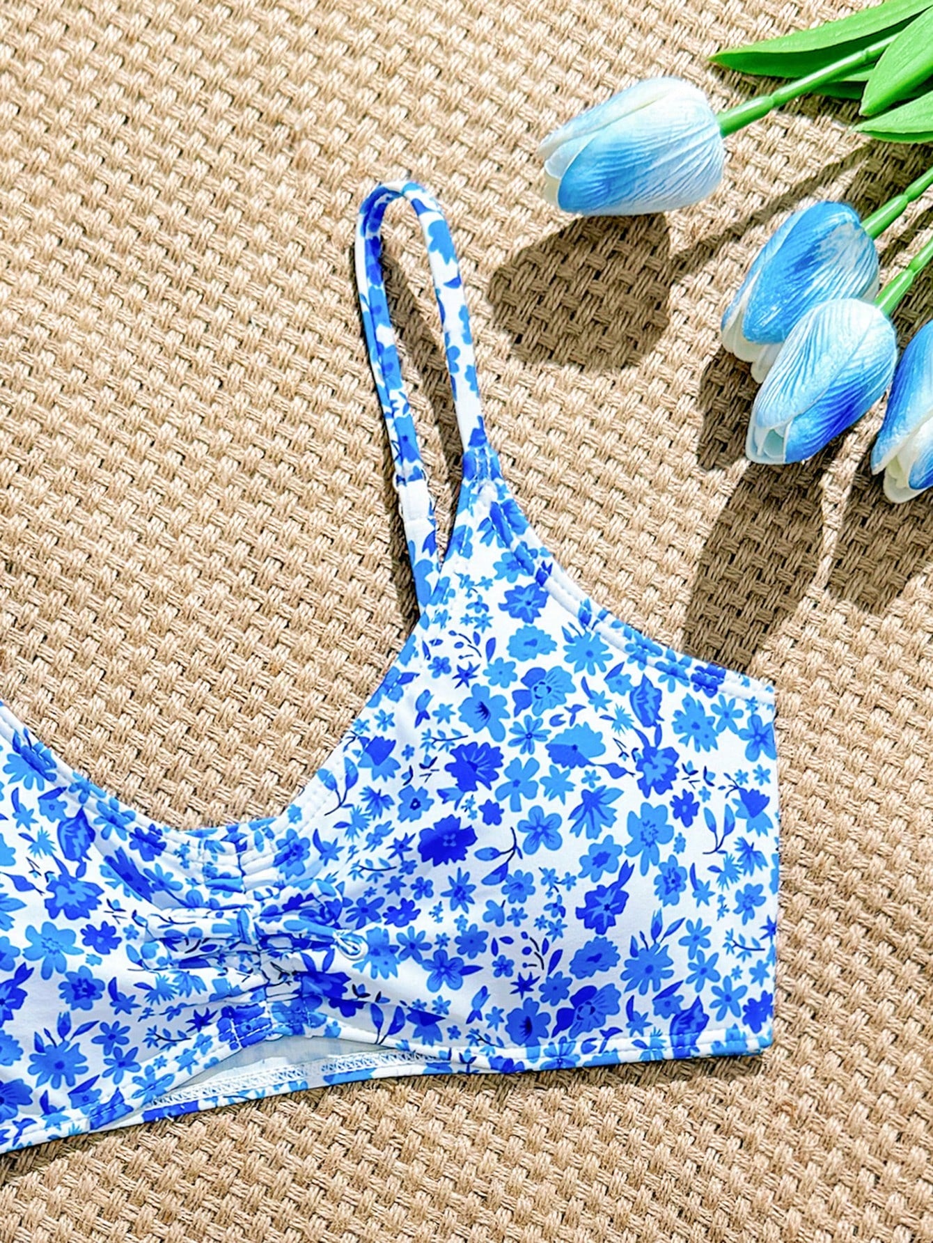 Tween girls 2-piece ditsy floral bikini set featuring a spaghetti strap top with center string detail and matching bottoms with side strings, designed for swimming, vacation, and summer wear.